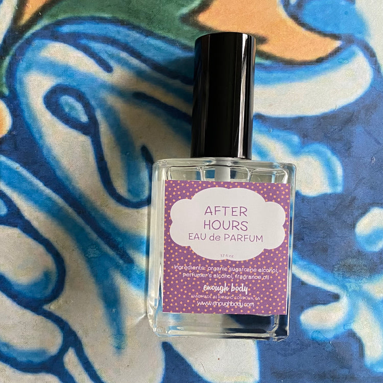 Perfume bottle labeled 'After Hours Eau de Parfum' on a colorful abstract background