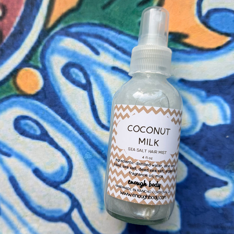 Coconut Milk sea salt hair mist bottle on a colorful background