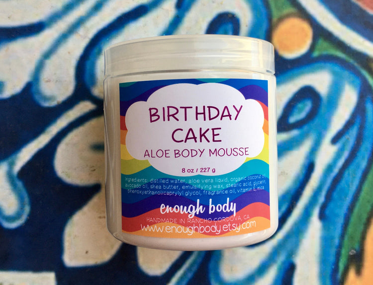 Jar of birthday cake Aloe Body Mousse on a colorful background