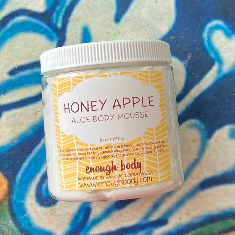 Jar of honey apple Aloe Body Mousse on a colorful background
