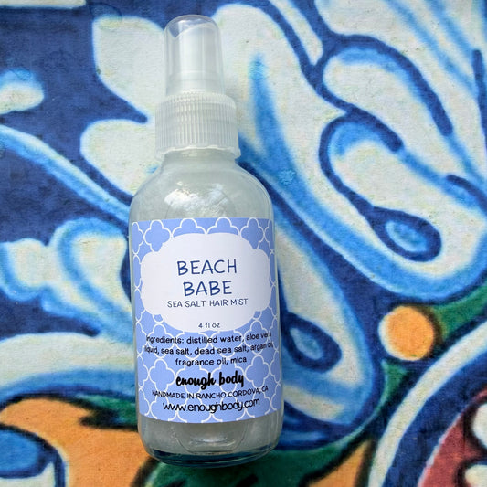 Beach babe sea salt hair mist bottle on a colorful background