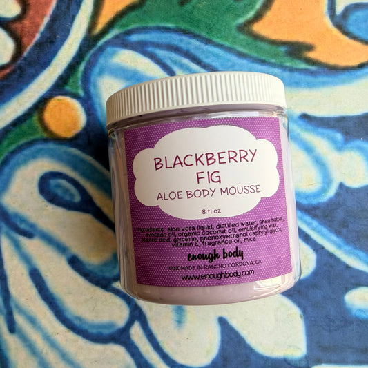 Jar of Blackberry Fig Aloe Body Mousse on a colorful background