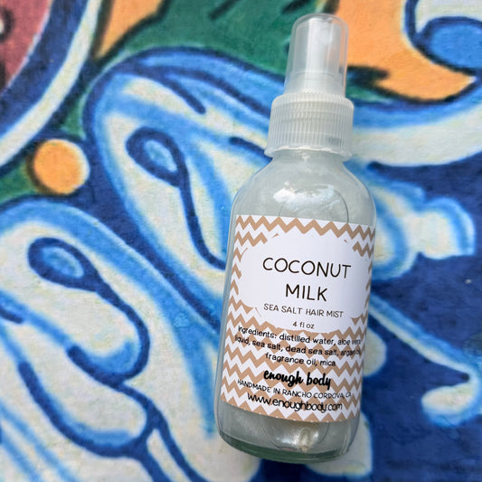 Coconut Milk sea salt hair mist bottle on a colorful background