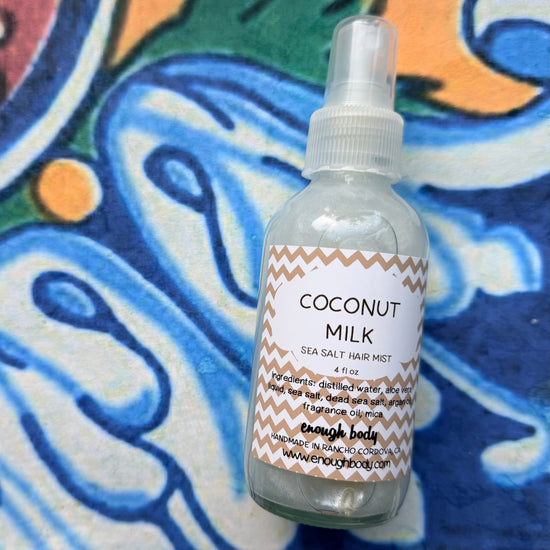 Coconut Milk sea salt hair mist bottle on a colorful background