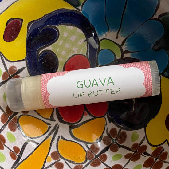 Guava lip butter on a colorful ceramic plate