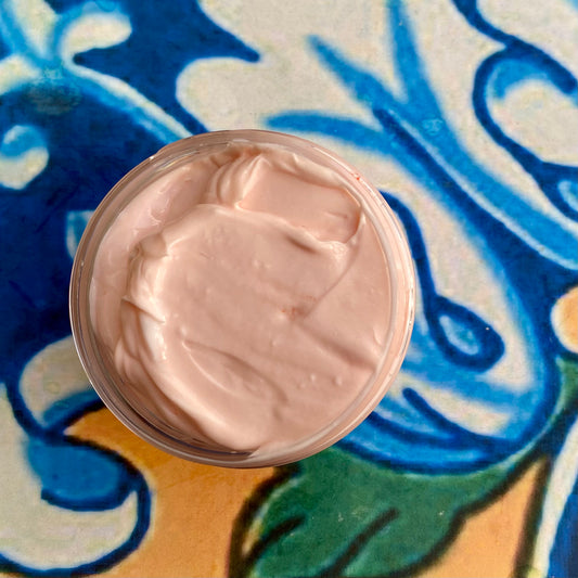 Light orange colored cream on a colorful abstract background