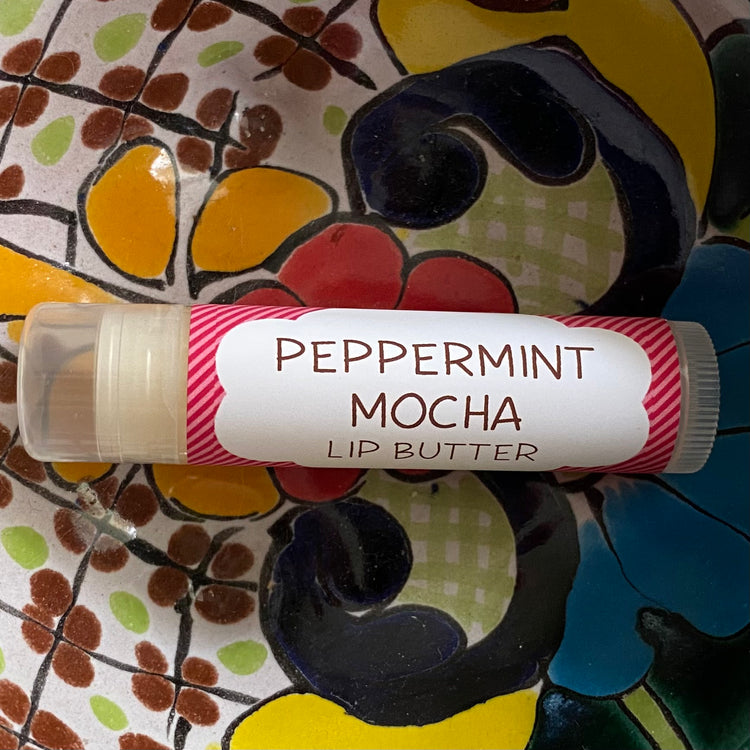 Peppermint Mocha lip butter on a colorful ceramic plate