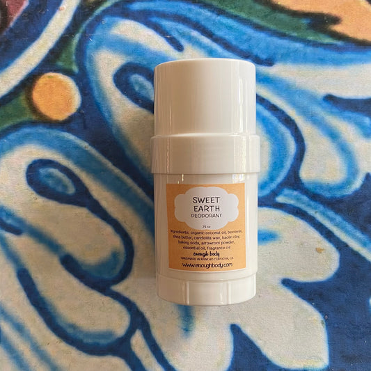 White deodorant stick with a label on a colorful abstract background