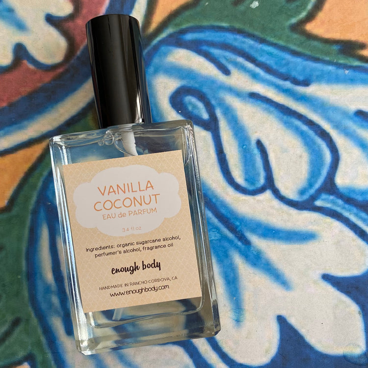 Vanilla Coconut eau de parfum bottle on a colorful abstract background