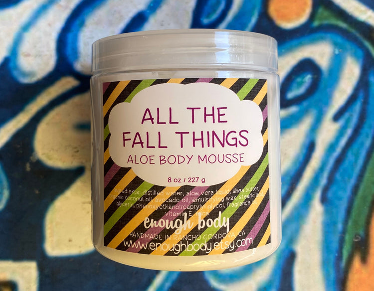 Jar of all the fall things Aloe Body Mousse on a colorful background