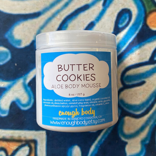 Jar of butter cookies Aloe Body Mousse on a colorful background