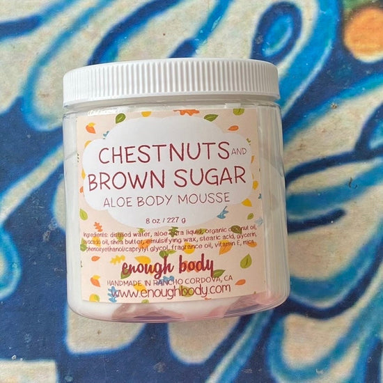 Jar of chestnuts and brown sugar Aloe Body Mousse on a colorful background