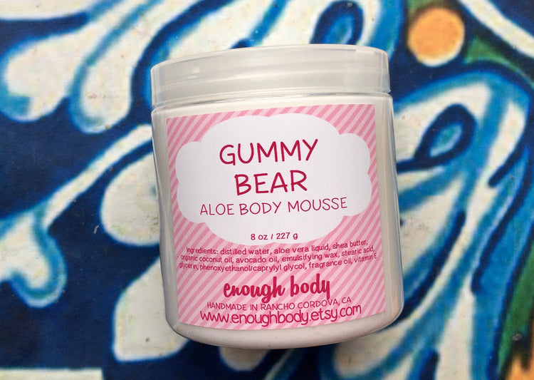 Jar of gummy bear Aloe Body Mousse on a colorful background