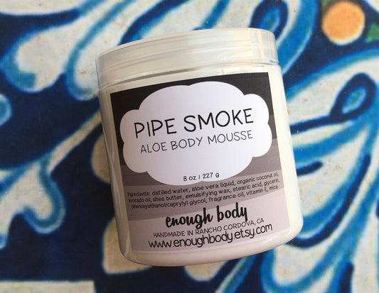 Jar of pipe smoke Aloe Body Mousse on a colorful background